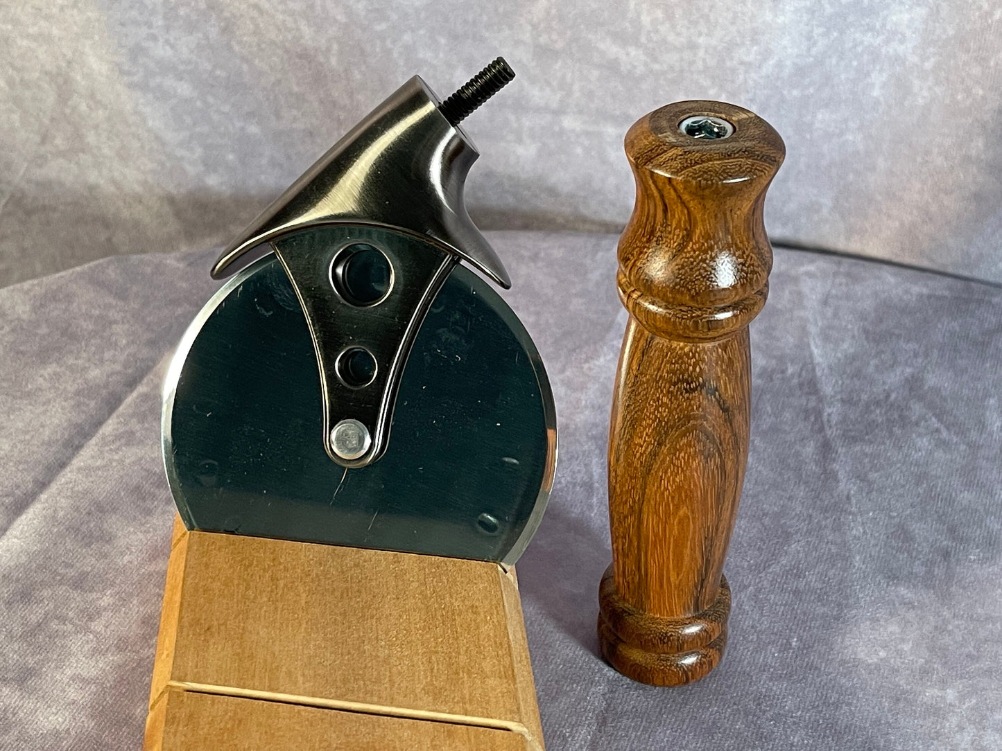 Pizza cutter with handle turned from Monkeypod wood.